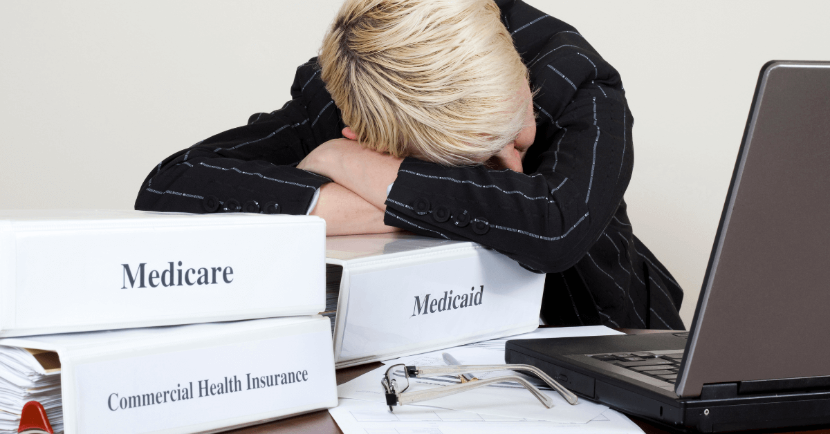 female office worker tired with processing medical claims