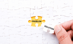 "Solution" jigsaw puzzle piece at "Problem" word.